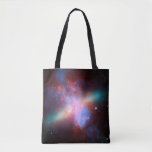 Galaxy M82 Tote Bag<br><div class="desc">This image shows a stunning view of a Starburst galaxy produced by space telescopes. M82 is a galaxy about 12 million light years from Earth that is undergoing a burst of star formation. X-rays from Chandra (blue) show gas being blasted away from the galaxy's disc as a bounty of stars...</div>