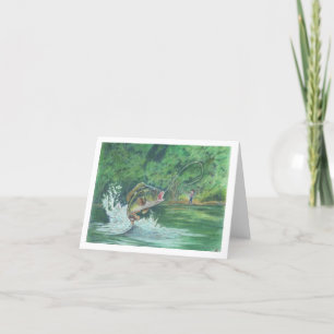 Garçon qui attrape une carte de billet de poisson