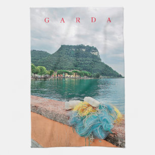 Garda Rock and fishing nets view tea towel