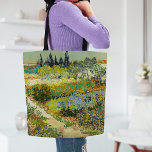 Garden at Arles | Vincent Van Gogh Tote Bag<br><div class="desc">Garden at Arles (1888) by Dutch post-impressionist artist Vincent Van Gogh. Original artwork is an oil on canvas depicting a lush landscape of colourful flowers. 

Use the design tools to add custom text or personalize the image.</div>
