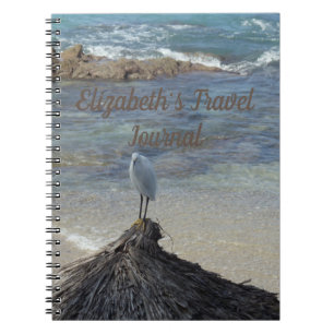 Garza Blanca at the seaside sand and blue ocean. Notebook