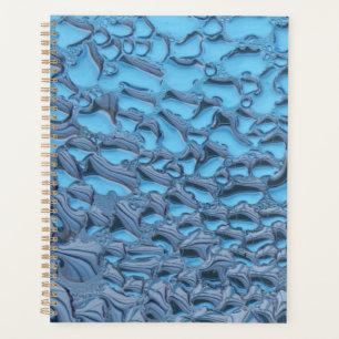 Gentle raindrops on blue glass planner