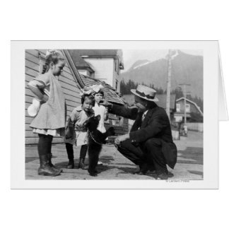 Gentleman and Kids Playing with Bear Cub On Leas