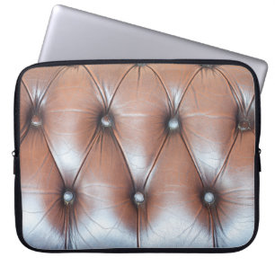 Genuine leather upholstery background,  luxury dec laptop sleeve