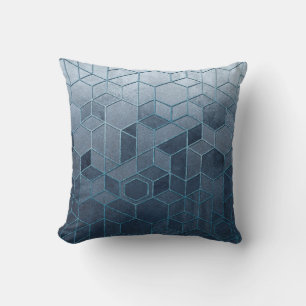 Geometric abstraction of hexagons on a blue relief throw pillow