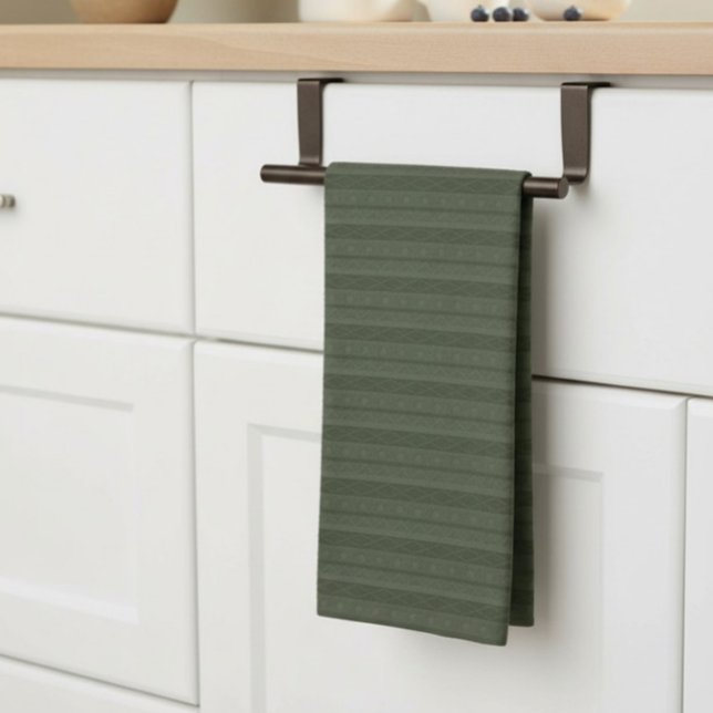 Geometric Aztec Olive Green Striped Kitchen Towel (geometric, striped, deep green tea towel, neatly hung on a bar on a kitchen counter.)