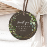 Geometric Gold Brown Thank You Wedding Favour  Classic Round Sticker<br><div class="desc">This geometric gold brown thank you wedding favour classic round sticker is perfect for a rustic wedding. The design features hand-painted beautiful green leaves in a brown background, adorning a gold geometric frame. Make the sticker labels your own by including your names, the event (if applicable), and the date. These...</div>