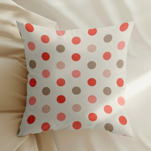 Geometric polka dot pattern in red and pink tones throw pillow