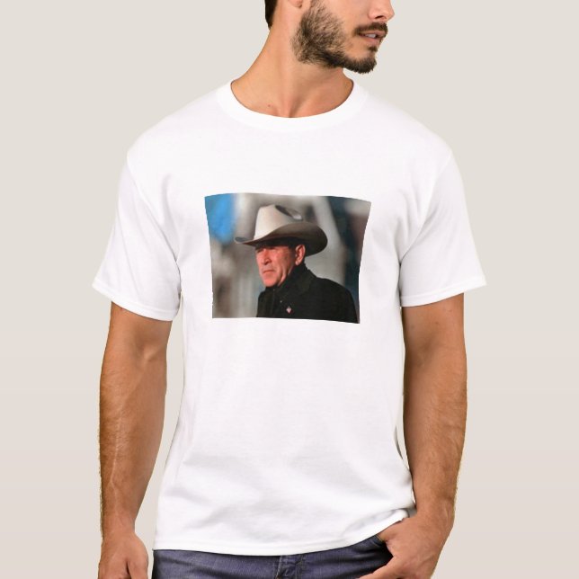 George W. Bush - dressed in black wearing a cowboy T-Shirt