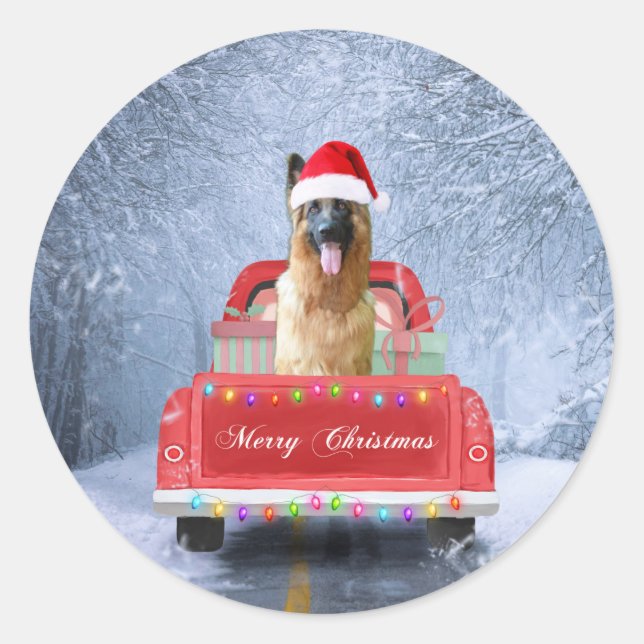 German Shepherd Dog in Snow sitting in Christmas Classic Round Sticker (Front)