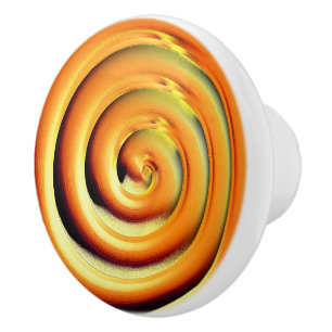 Giant shiny orange spiral over black ceramic knob