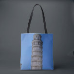 Gift Bag<br><div class="desc">This captivating photograph showcases the iconic Leaning Tower of Pisa standing elegantly against a deep blue twilight sky in Pisa. The historic marble tower, famous for its unmistakable tilt, is beautifully illuminated, highlighting its intricate Romanesque arches and layered columns. The soft evening light creates a striking contrast between the glowing...</div>