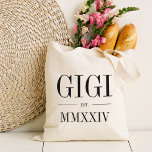 Gigi Roman Numeral Year Established Tote Bag<br><div class="desc">A modern minimalist tote bag to celebrate a chic grandma,  this clean minimal tote features "Gigi" or your choice of grandma nickname in black serif lettering. Customize with the year she became a grandmother beneath in elegant roman numerals for a chic touch.</div>