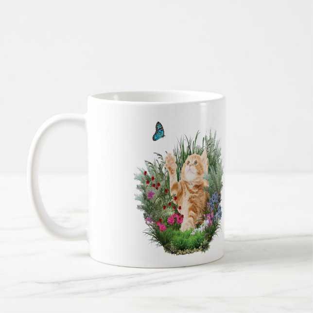 Ginger kitten playing  coffee mug (Left)