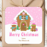 Gingerbread House Pink Merry Christmas Square Sticker<br><div class="desc">This cute and festive Merry Christmas sticker can be personalized with a name, relation or title. It features a cute gingerbread house decorated with pink and green candy. Beside it are adorable gingerbread men with gifts, dressed in Santa hats and a scarf. In the background is a bright pink winter...</div>
