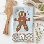 Gingerbread Man Blue Monogram Merry Christmas Kitchen Towel<br><div class="desc">Celebrate the holiday season with this custom gingerbread man Merry Christmas kitchen towel. Featuring a cute gingerbread man with a red bow tie, a festive "Merry Christmas" greeting, and a personalized monogram on a blue background, this towel adds a fun and festive touch to your kitchen decor. Perfect for gifting...</div>