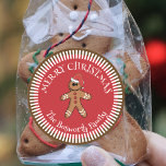 Gingerbread Man with Santa Hat Merry Christmas Classic Round Sticker<br><div class="desc">Add a touch of warmth and joy to your Christmas gifts with our customizable sticker! This charming sticker features a delightful gingerbread man, adorned with a festive Santa hat, set against a vibrant red background. Radiating white stripes create a starburst effect, framing the cheerful message "MERRY CHRISTMAS". Personalize it with...</div>