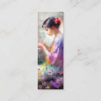 Girl admiring a flower in her hands  mini business card