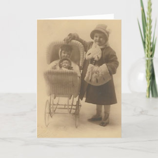 girl and her doll in carriage greeting card