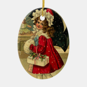 Girl carrying a christmas gift ceramic ornament