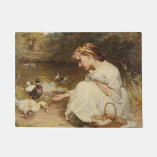 Girl Feeding Ducks (by Frederick Morgan) Doormat