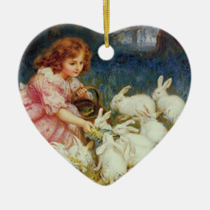 Girl feeding rabbites ceramic ornament