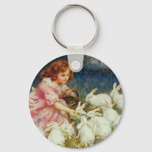 Girl feeding rabbites keychain