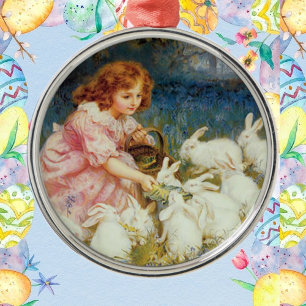 Girl feeding rabbites metal ornament