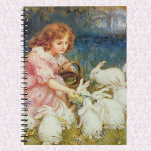 Girl feeding rabbites notebook