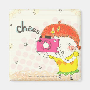 Girl holding camera, clicking magnet
