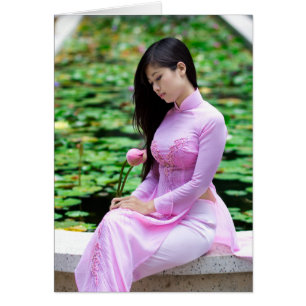 Girl holding lotus at the fountain