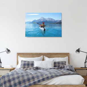Girl in Kayak with Red Cap Mountains Lake Canvas Print