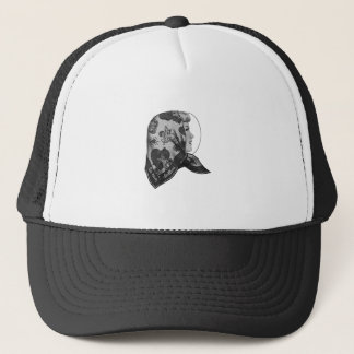 Girl in profile with printed scarf on her head trucker hat