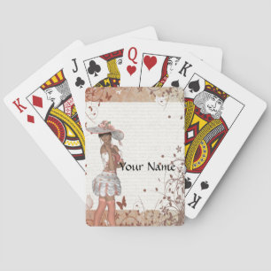 Girl in summer hat playing cards