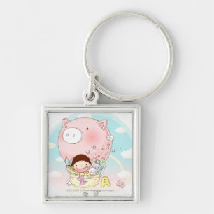 Girl sitting in hot air balloon, smiling keychain