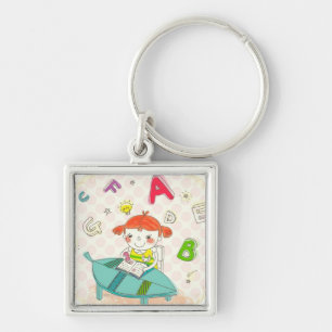 Girl sitting on chair, studying keychain