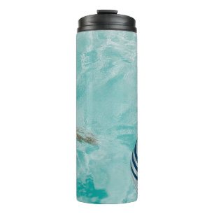 Girl wearing swimsuit and swims in swimming pool thermal tumbler