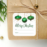 Glam Green Gold Ornaments Merry Christmas To From Square Sticker<br><div class="desc">This glam holiday gift sticker features a trio of green and gold faux foil and glitter ornaments, with a sprinkling of gold faux glitter in the background. The words "Merry Christmas" appear in elegant green faux foil calligraphy script, along with "TO" and "FROM" in green sans serif font on a...</div>
