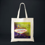 Glam Las Vegas Wedding Maid of Honour Gift Tote Bag<br><div class="desc">Big and glamourous Las Vegas strip sign tall palm trees and colourful stars yellow & purple shades background illustrated on custom Maid of Honour Gift Bags. Personalize the artsy and unique tote bags for your maid of honour and/or bridesmaids to thank them! ((You can find the matching wedding essentials &...</div>