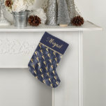 Glam Navy Blue Gold Reindeer Pattern Personalized Small Christmas Stocking<br><div class="desc">With its pattern of gold reindeer silhouettes leaping on a navy blue faux foil background, this Christmas stocking will make an elegant addition to your holiday decor. Personalize it with a name or other text in gold-coloured calligraphy on a solid navy blue colour block with a gold-coloured edge. The design...</div>