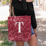 Glam Red Faux Glitter Bokeh Sparkles Monogram Tote Bag<br><div class="desc">A modern bold single letter monogram in white with a black drop shadow. The font size, colour and style are customizable. The background is a faux red glitter with sparkly spots or bokeh. Move or delete the tiny faux sparkle graphic images. Girly chic gift for a bridesmaid or other member...</div>