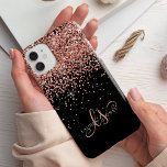 Glam Rose Gold Glitter Elegant Monogram iPhone 14 Case<br><div class="desc">Glam Rose Gold Glitter Elegant Monogram iPhone Case. Easily personalize this trendy chic phone case design featuring elegant rose gold sparkling faux glitter on a black background. The design features your handwritten script monogram with pretty swirls and name.</div>