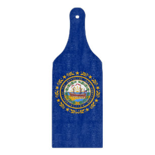 Glass cutting board paddle with New Hampshire flag