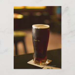 Glass of Irish ale in pub Postcard