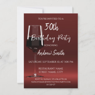 Glass of red wine on red invitation