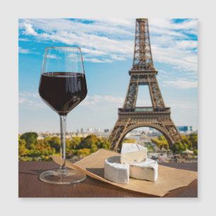 Glass of wine with brie cheese on Eiffel tower