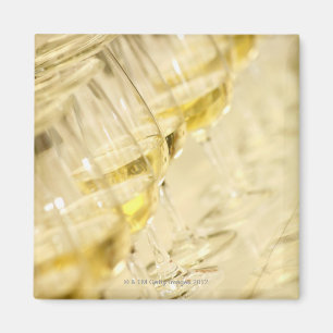 Glasses of white wine for wine tasting, close up magnet