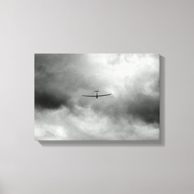 Glider flying in gray sky canvas print (Front)