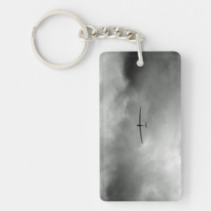 Glider flying in grey sky keychain