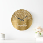 Glittery Gold Glam White Script Name Large Clock<br><div class="desc">Customize the modern handwritten style script to create your own large round wall clock. Add a monogram initial behind the name to create your own first name initial combination. Girly glam faux gold glitter and golden metallic faux foil digital art image that prints like a photo on her gift. There...</div>